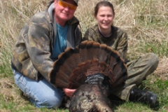 Mark Porter and his daughter Kerry with her first Gobbler taken during the 2009 youth season in Pike County, IL. (Mark has had some trouble the past few years with his marksmanship and finally decided to ask his daughter to help harvest a bird. She made a perfect shot and we congratulate her!)